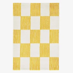 Alfombra interior con motivo damero amarillo y blanco