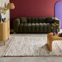 Alfombra interior con patrón moteado crema