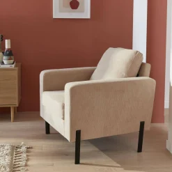 Sillón de pana y patas de metal