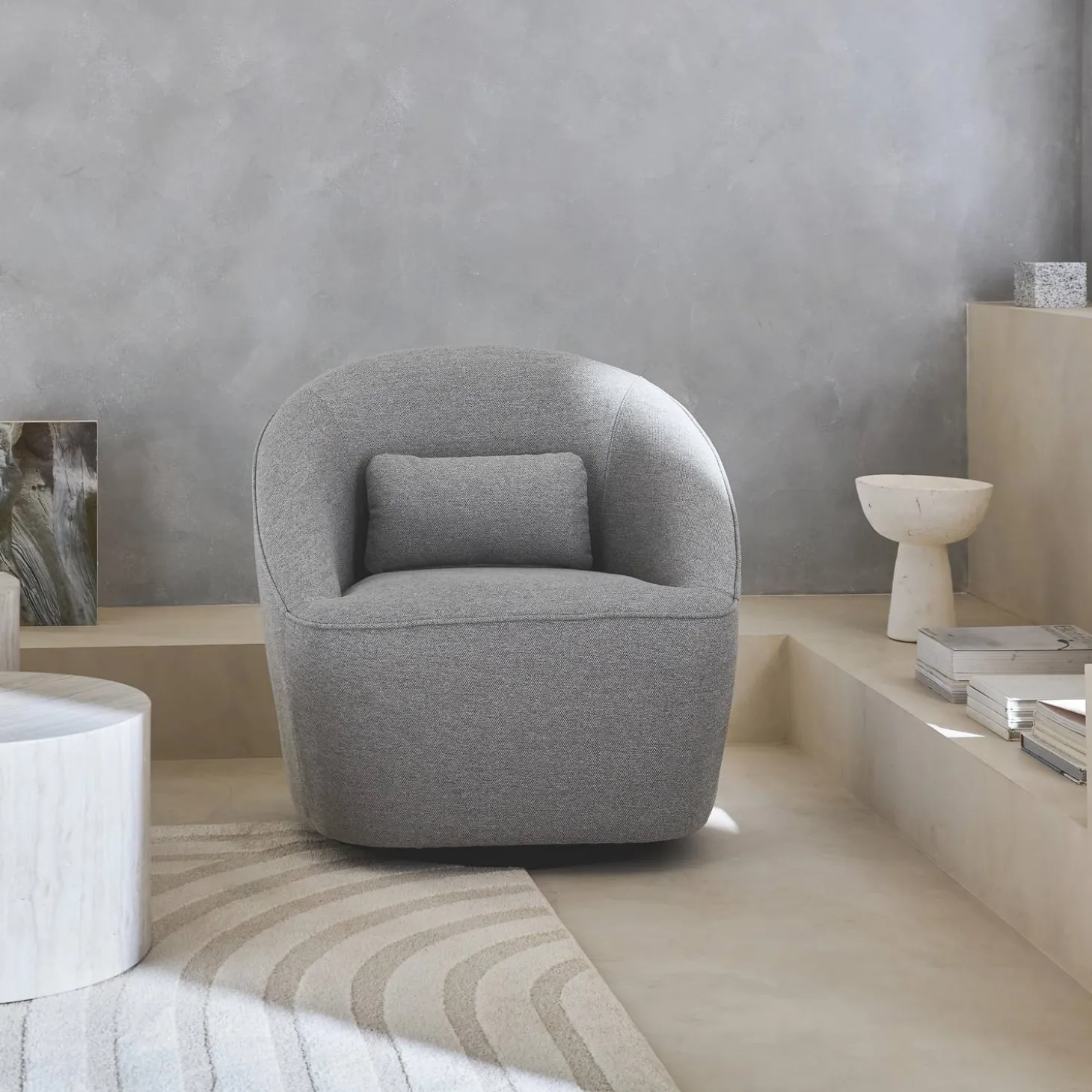 Sillón giratorio de tela 360º con cojín