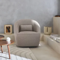 Sillón giratorio de tela 360º con cojín