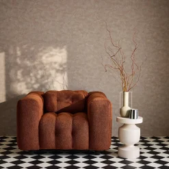 Sillón tapizado en tejido borreguito