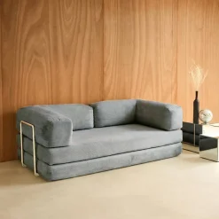 Sofá cama con futón plegable en pana y estructura cromada, 3 plazas